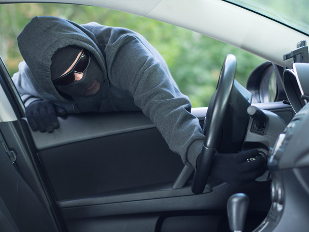 Burglar wearing mask balaclava, car burglary - Foto, Imagen
