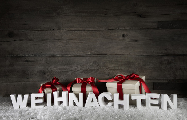 Fond en bois avec des cadeaux et le texte Noël en allemand
 - Photo, image