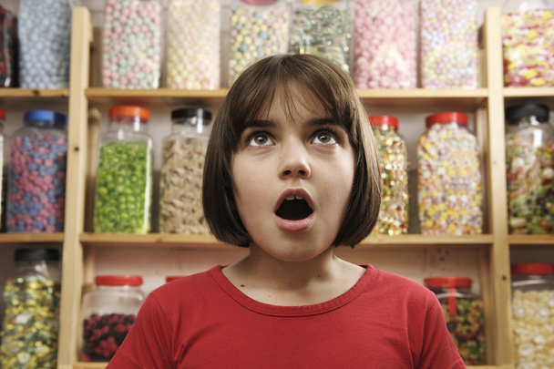 Girl in sweet shop - Photo, Image