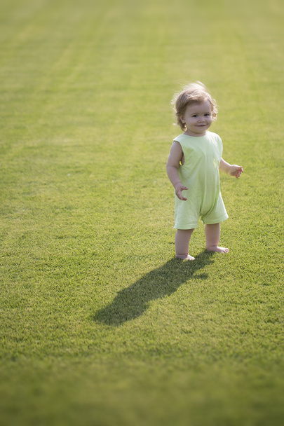 Baby boy on green grass - Фото, зображення
