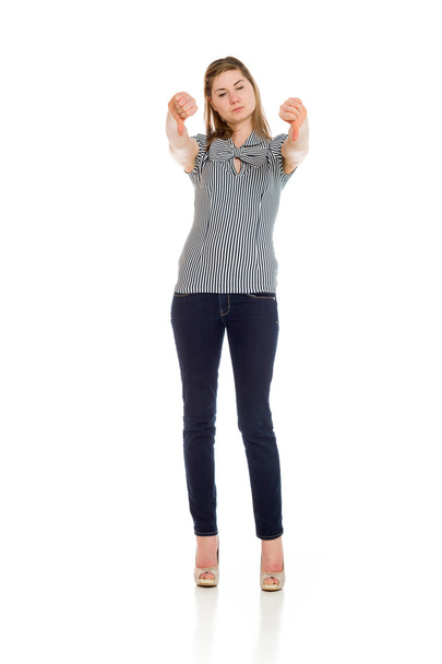 Model gesturing thumbs down - Фото, изображение