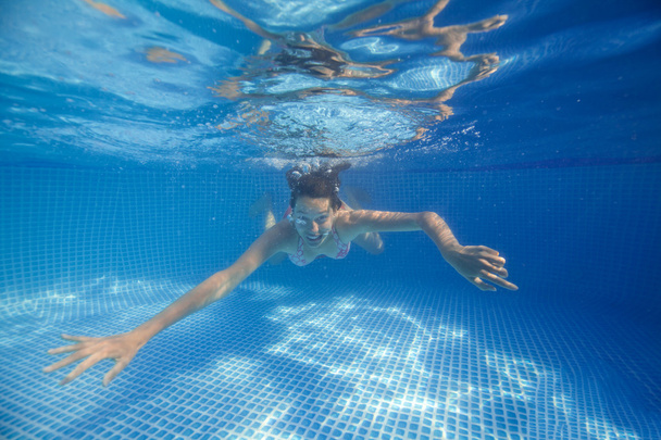 Underwater woman in swimming pool. - Photo, Image