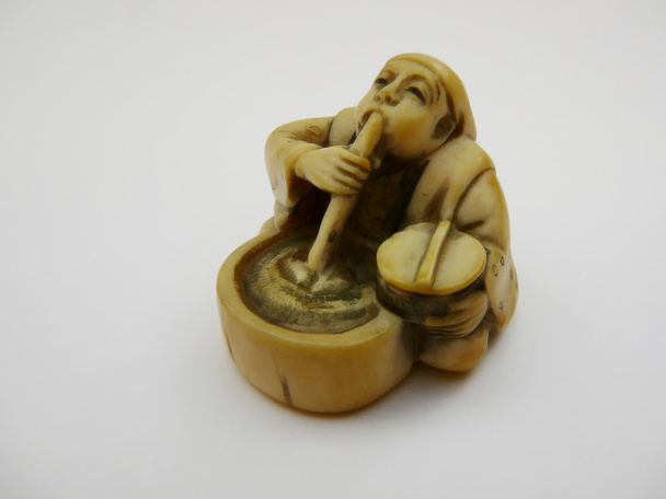 apró figura, egy ópium dohányos - Fotó, kép