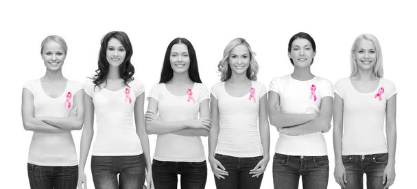 smiling women with pink cancer awareness ribbons - Zdjęcie, obraz