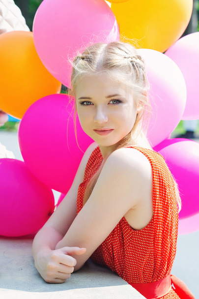 Closeup portrait of tender young woman with balloons - Φωτογραφία, εικόνα