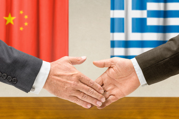 Representatives of China and Greece shake hands - Photo, Image