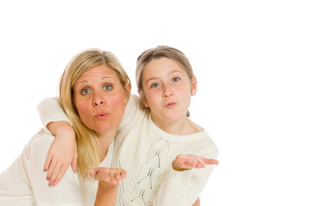 Mother and daughter blowing a kisses - Foto, immagini