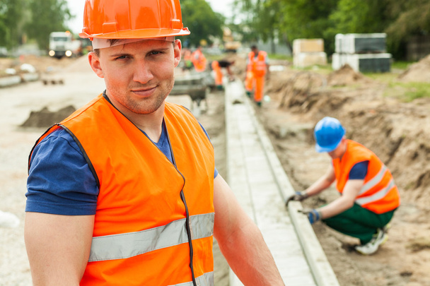 Construction worker in safety waistcoat - Zdjęcie, obraz