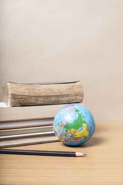 book and earth ball with black pencil - Photo, image