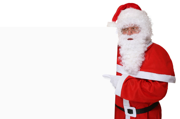 Santa Claus con sombrero apuntando a la Navidad en banner vacío con
  - Foto, Imagen
