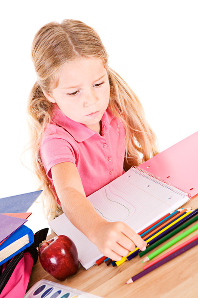Education: Little Girl Using Colored Pencils In Notebook - Valokuva, kuva