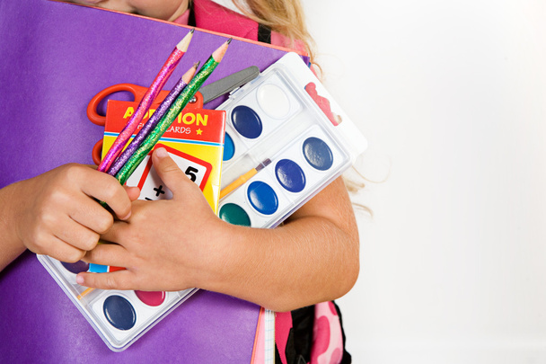 Education: Girl Holds Armful Of School Supplies - 写真・画像