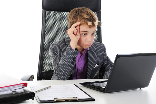 Young businessman using a laptop - Fotó, kép