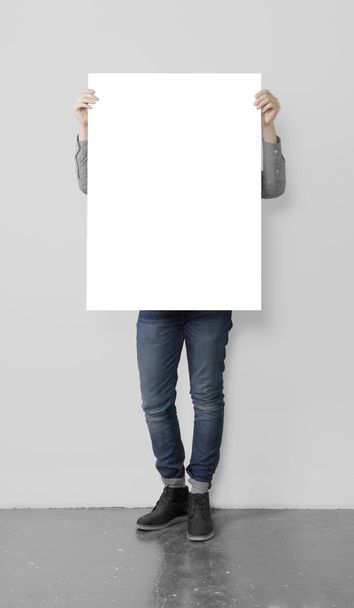 hipster holding blank poster - Foto, afbeelding