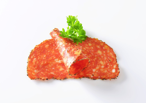 Salame revestido a pimenta preta com queijo
 - Foto, Imagem