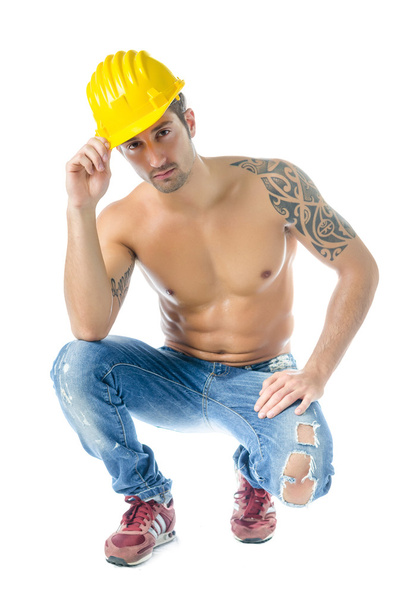 Handsome, muscular construction worker shirtless isolated - 写真・画像