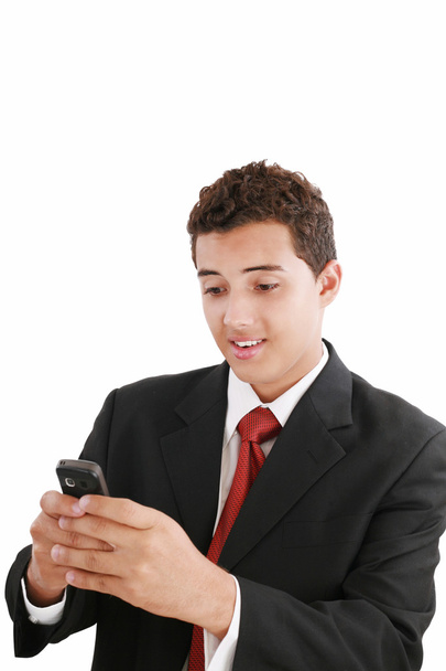 Красивый молодой бизнесмен пишет смс на телефон
 - Фото, изображение