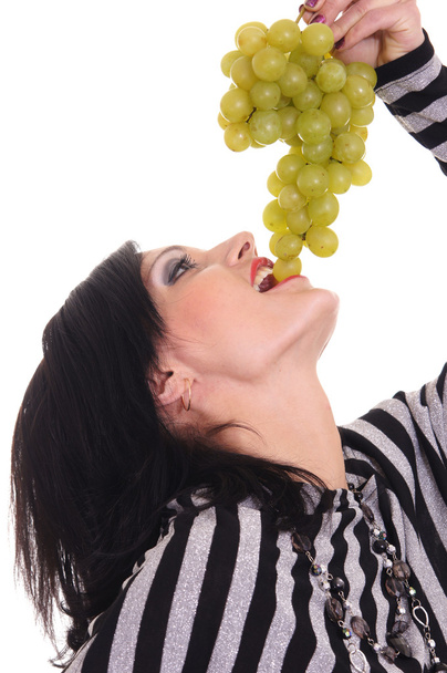 Girl eating grapes - Foto, afbeelding