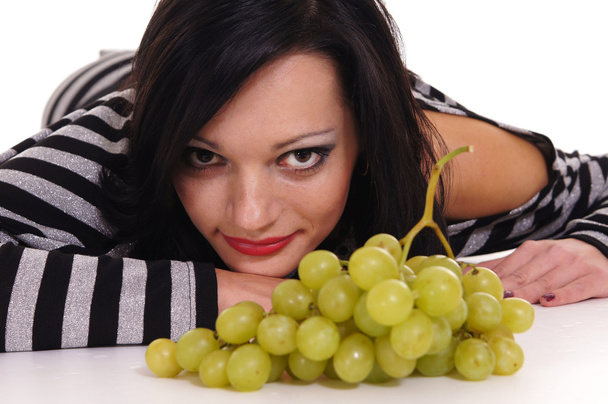 Young woman with grape - Φωτογραφία, εικόνα
