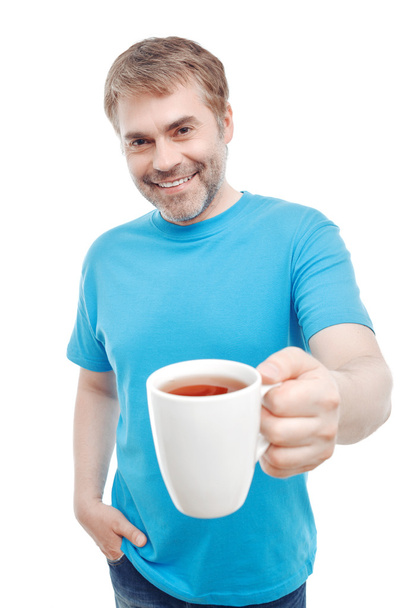Pleasant man drinking tea  - Фото, изображение