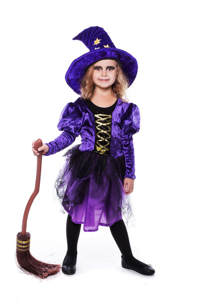 Adorable little blond girl wearing a witch costume smiling at the camera. Halloween. Fairy. Tale. Studio portrait isolated over white background - Фото, зображення