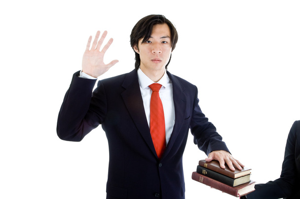 Business Man kiroileva pino Raamattuja, eristetty
 - Valokuva, kuva