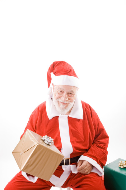 Smiling Santa Holding Wrapped Package Isolated - Photo, Image