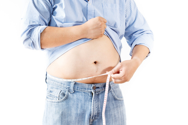 Fat man measuring his waist - Zdjęcie, obraz