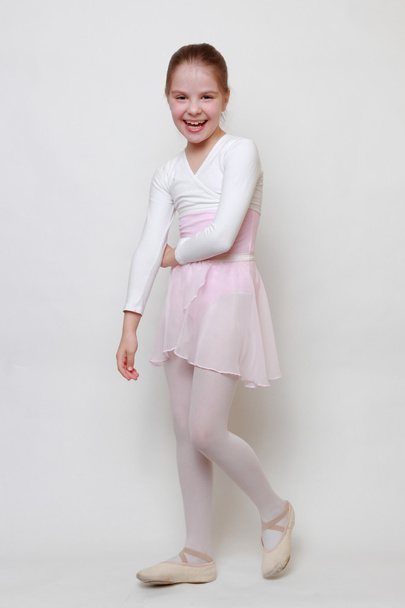 little ballerina in studio posing on camera - Foto, afbeelding