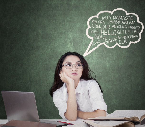 Lovely student with speech bubble of multi language - Foto, Imagen