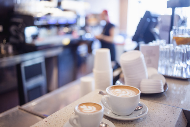 latte art by barista focus in milk and coffee,  vintage color  - Φωτογραφία, εικόνα
