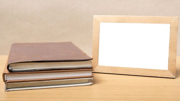 stack of book and photo frame - 写真・画像
