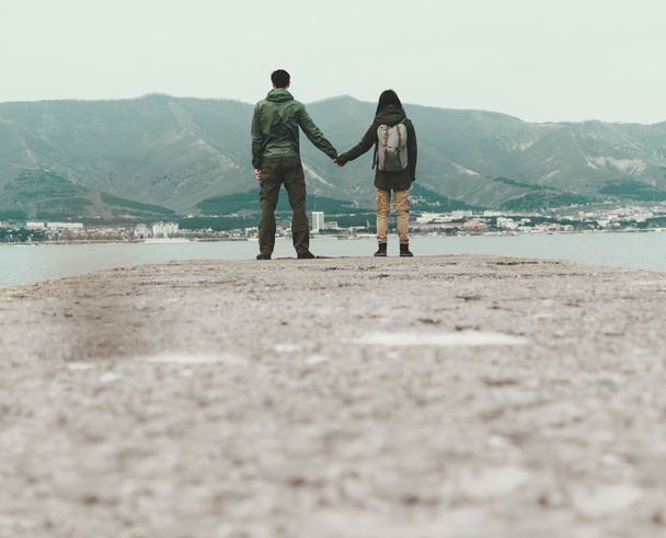 Traveler loving couple standing on pier - Photo, Image