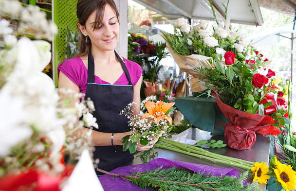 florist woman works in her store - Foto, Imagem