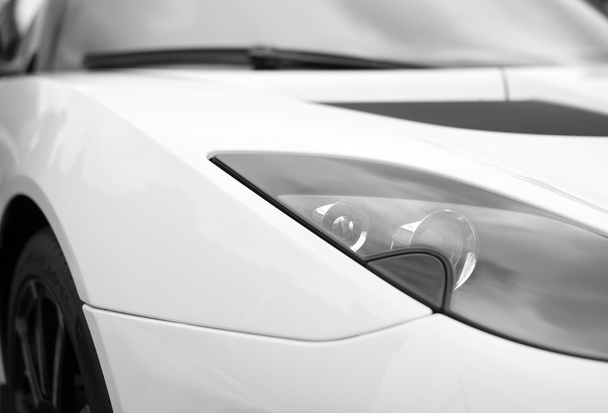 Close-up view of white sports car headlight. - Photo, Image