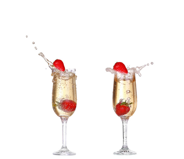 Single Strawberry splashing into a glass of champagne - Photo, Image