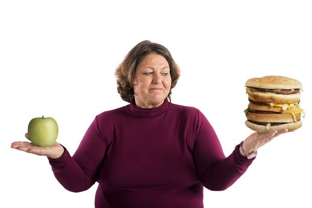 Vrouw onbeslist of moet worden gestart het dieet - Foto, afbeelding