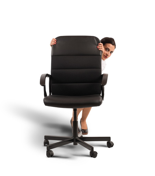 Businesswoman behind a chair - Фото, изображение