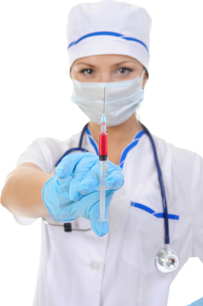 Nurse with a syringe in his hand. - Foto, afbeelding
