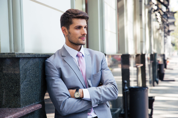 Portrait of a pensive businessman with arms folded  - Photo, Image