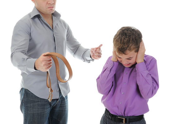 Strict father punishes his son - Foto, afbeelding
