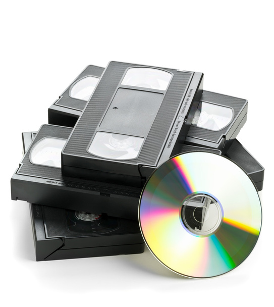 Heap of analog video cassettes with DVD disc - Foto, Imagen