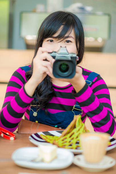 Portrait of hipter beautiful young woman with a camera - Photo, Image