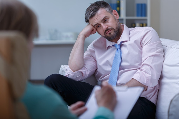 Despair businessman during psychotherapy - Фото, зображення