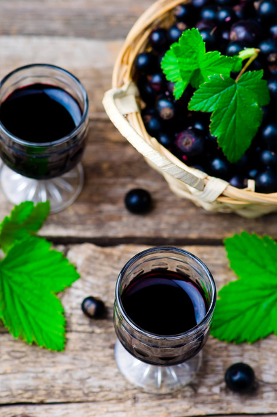liqueur from blackcurrant in a shot glass - Photo, image