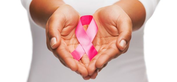 hands holding pink breast cancer awareness ribbon - Fotografie, Obrázek