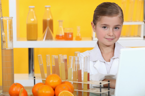 Girl analysing juice - Foto, Imagen