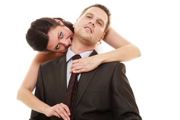 Woman pulling tie of man - Foto, immagini