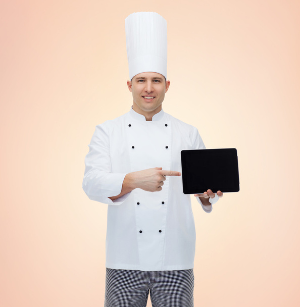 happy male chef cook showing with tablet pc - 写真・画像