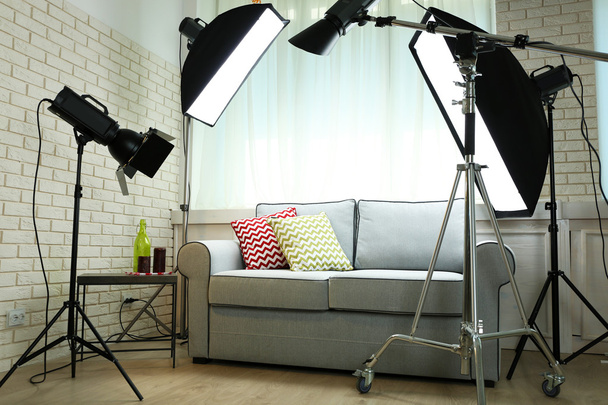 Photo studio with modern interior and lighting equipment - Photo, image